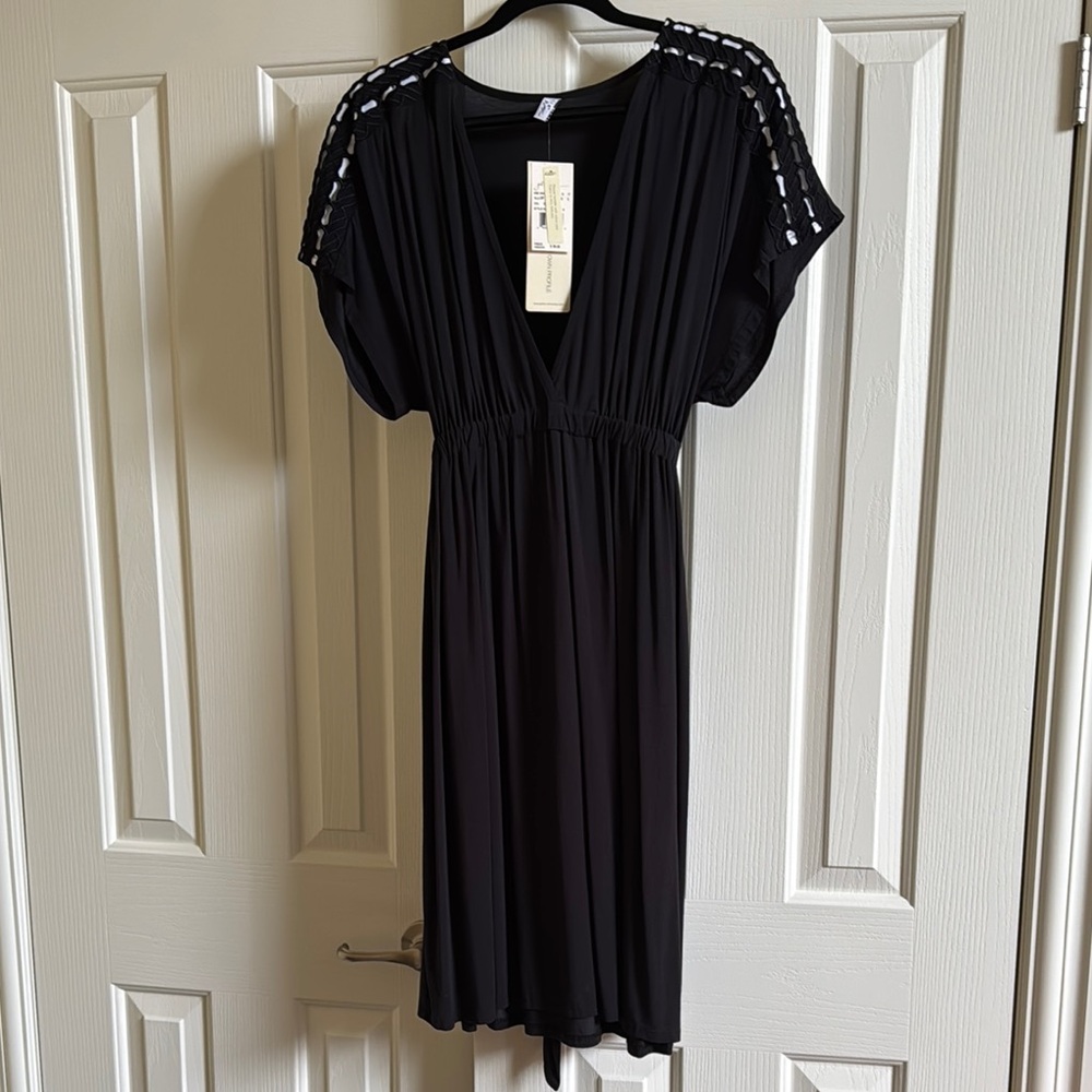 Elegant Black Dress with Unique Shoulder Design